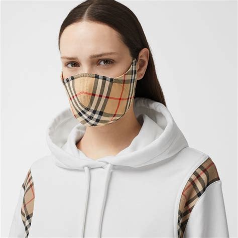 burberry london face mask|Burberry releases face mask with signature check pattern.